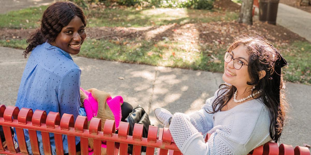 Two AACC students smiling outside.